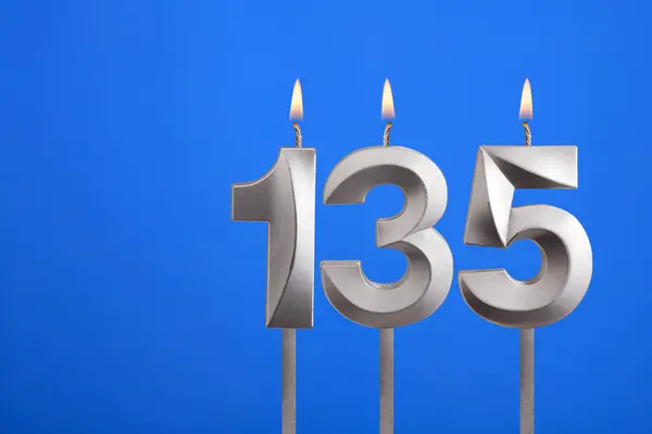 stock image Birthday candle number 135 - Celebration card on blue background