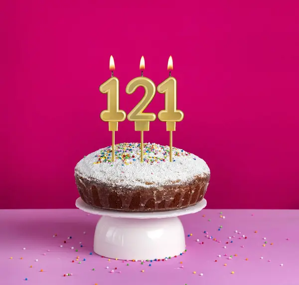 stock image Birthday cake with number 121 candle on pink background