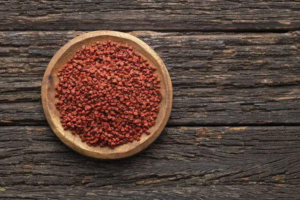 stock image Organic red annatto seeds in the bowl - Bixa Orellana