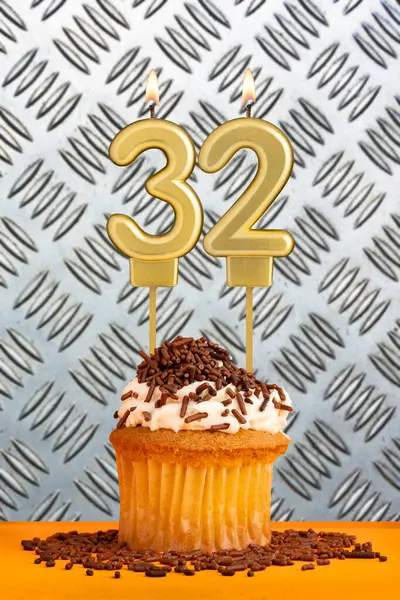 stock image Birthday candle number 32 - Industrial metallic background.