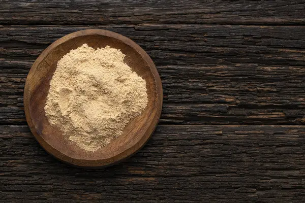 stock image Organic peruvian maca powder in the bowl - Lepidium meyenii