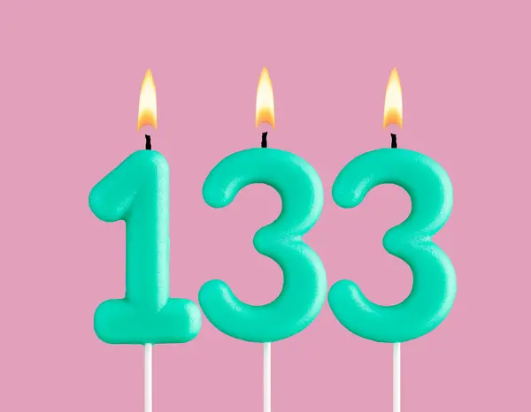 stock image Birthday card with green number 133 candle - Pastel pink background