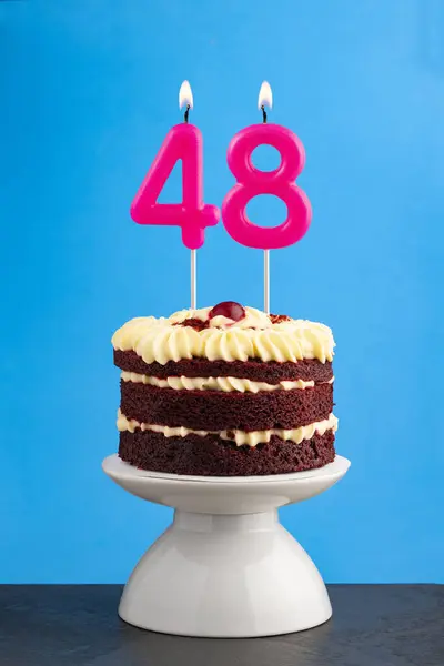 stock image Red velvet birthday cake with number 48 candle