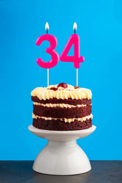 stock image Red velvet birthday cake with number 34 candle