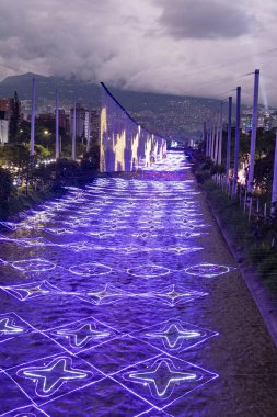 Medellin, Antioquia. Colombia - January 2, 2024. Luminous figures with Christmas themes decorate the river parks sector. clipart