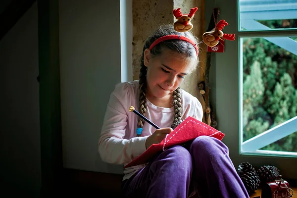 Dreamily Girl Wearing Fun Hat Writes Letter Santa Waiting Gifts — Stock Photo, Image