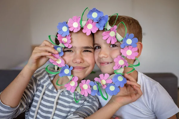 Transformation an ordinary egg carton into a beautiful Easter flower wreath. Kids show the creative and sustainable possibilities of Zero Waste lifestyle. Reduce, reuse, and recycle. DIY with kids