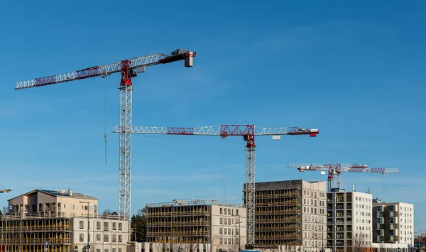 construction site under the sky, new building with a blue background, tower crane and building construction site with cranes