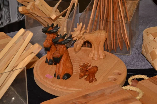 wooden handmade wood products, table with wood carving and a moose on it