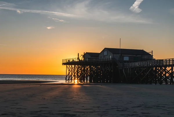 stock image stilt houses at sunset, North Sea, Sankt Peter-Ording, Germany