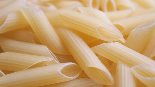 Pile Raw Yellow Pipe Shaped Pasta Lies Surface Raw Pasta — Stock Video
