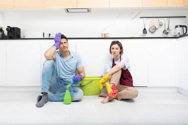 Tired Couple Sitting Floor Exhausted Cleaning Day Home — Stock Photo, Image