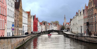 View on Jan Van Eyck Square and the Spiegelrei canal on a cloudy day in Bruges, Belgium