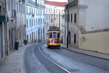 LISBON, PORTUGAL, SEP 27, 2022: red retro Tram 28 advertising company Coca-Cola on the streets of Lisbon