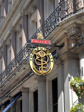 London, UK - Feb 2, 2023: Hanging street sign of The Admiralty, a pub at 66 Trafalgar Square, London clipart