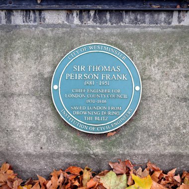 London, UK - Nov 7, 2020: Sir Thomas Peirson Frank plaque on Embankment wall in Victoria Tower Gardens, Westminster, London SW1 clipart