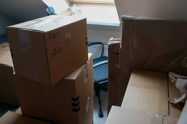 close up of moving cardboard boxes in home office. High quality photo