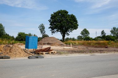 Construction site beginning to build a family house at day light clipart