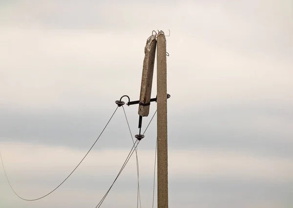 stock image Broken electrical post in Kharkiv region, Ukraine. Electric wire of a broken high voltage pole is damaged