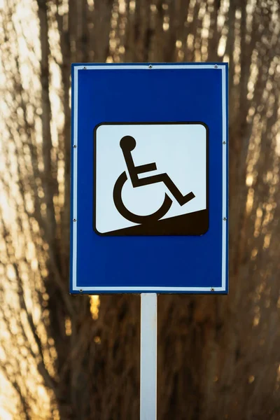 Wheelchair ramp sign outdoors, symbol for the disabled