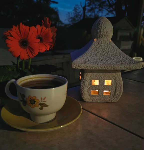 a cup of tea on the table. night atmosphere. the concept of a cozy house.