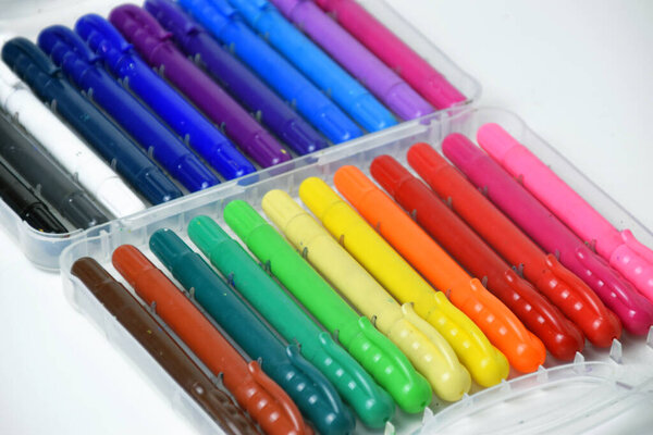 A set of colorful silky crayon sticks for drawing and coloring, arranged on a clean white isolated background. Ideal for kids, school projects, and creative artwork.