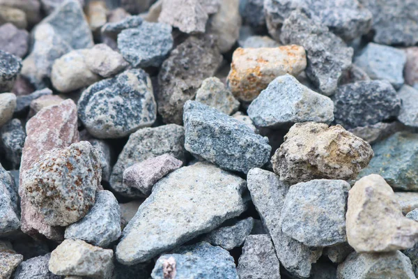 pebble texture in photos from various angles. gravel is usually made for the construction of roads, and as a mix stone to produce bricks.
