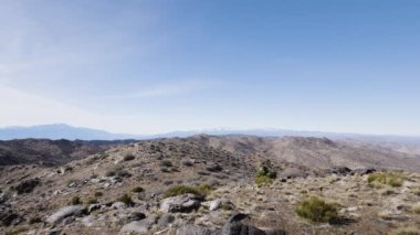 View from the summit of Quail Mountain, the highest peak in Joshua Tree National Park, a popular destination in Californias Mojave Desert. The snow-capped San Bernardino mountains rise in the west.