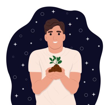 Dünya Toprak Günü her yıl 5 Aralık 'ta düzenlenir. Adam onun ellerinde yeşil bir bitki tutuyor. Orman restorasyonu, ağaçların yeniden ağaçlandırılması