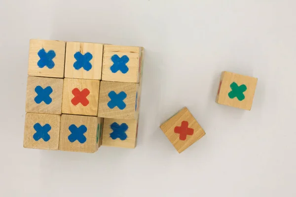 wooden cubes with a toy game on a white background