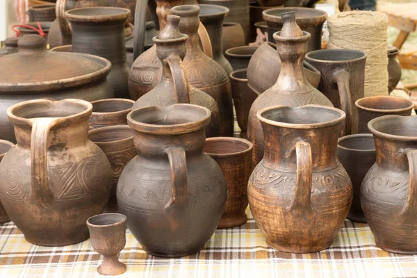 stock image clay pots on a shelf