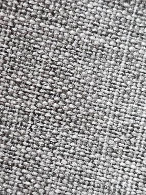 Arkaplan olarak gri örülmüş kumaş dokusu