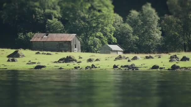 Tilt Shift Video Two Old Wooden Barns Rocky Fjord Coast — Stock Video
