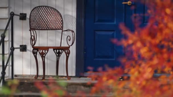 Wrought Iron Chair Stands Small Porch Blue Door Slow Motion — Stock Video