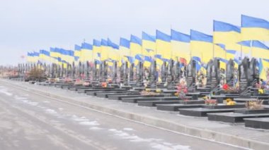 Kharkiv, Kharkiv Oblast, Ukraine. February 18, 2023, City Cemetery. Graves of Ukrainian soldiers in the Alley of Glory.