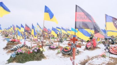 Kharkiv, Kharkiv Oblast, Ukraine. February 18, 2023, City Cemetery. Graves of Ukrainian soldiers in the Alley of Glory.