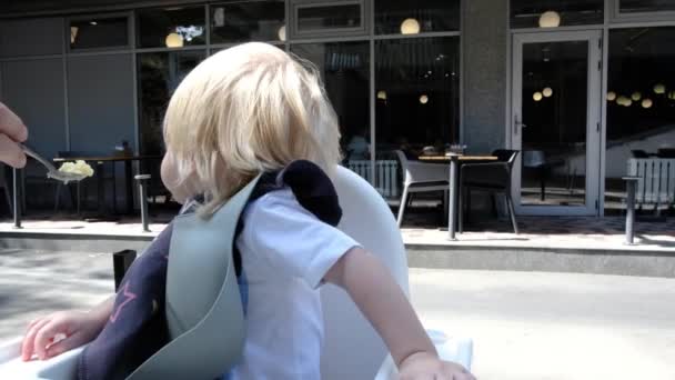 Portrait Little Cute Boy Eats Outdoors Cafe High Quality Footage — Vídeos de Stock