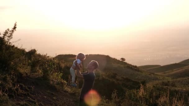 Father Throws His Son Air Sunset Highlands High Quality Footage — Vídeo de Stock