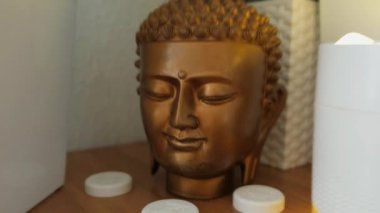 Close-up of the head of the holy Buddha from plaster. High quality 4k footage