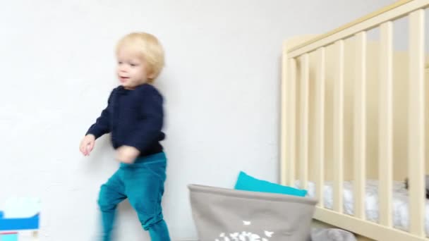 Cheerful Little Boy Runs Childrens Room High Quality Footage — Stock Video