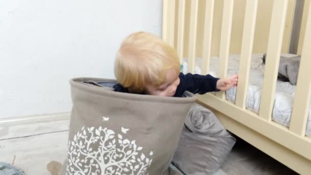 Cheerful Boy Crawls Out Basket Toys High Quality Footage — Stock Video