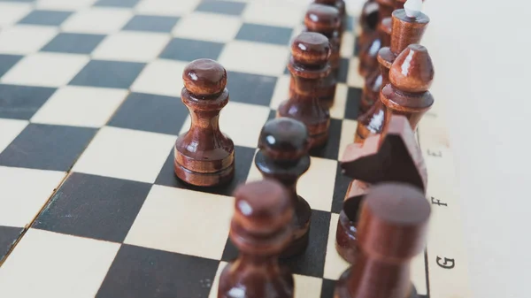 stock image Close-up of a chessboard with wooden pieces. High quality photo