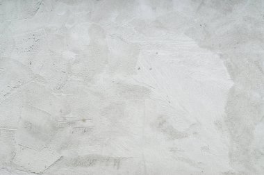 Evde ya da ikametgah binasında garip çizikler olan tamamlanmamış duvar, arkaplan dokusu olarak gri beton duvar kullanılıyor.