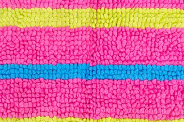 Multicolored beautiful doormat with horizontal neat pattern is used for background texture or wall paper in decorative art work.