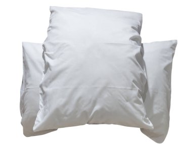 Two white pillows with cases after guest's use at hotel or resort room is isolated on white background with clipping path. Concept of comfortable and happy sleep in daily life