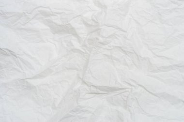 Dekoratif sanat eserlerinde arka plan dokusu için geniş kopya alanı olan tuvalet veya tuvalette kullanıldıktan sonra buruşmuş veya buruşmuş beyaz şablon kağıdı veya doku kullanılır..
