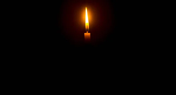 Single Burning Candle Flame Light Glowing Orange Candle Black Dark — Stock Photo, Image