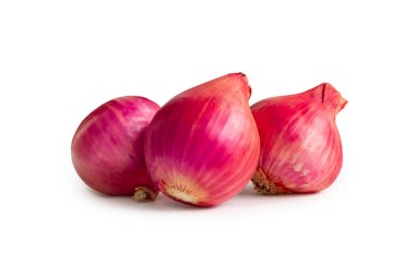 Fresh red onions in stack are isolated on white background with clipping path.