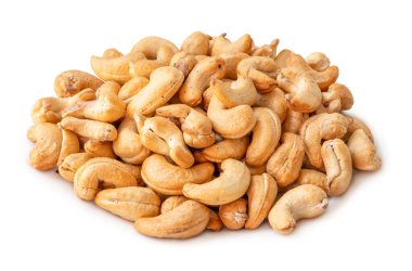 Roasted brown cashew nuts in stack are isolated on white background with clipping path.