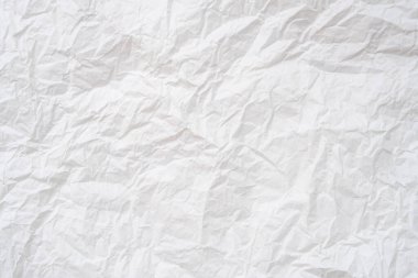 Buruşmuş ya da buruşmuş beyaz şablon kağıdı arkaplan dokusu için kullanılır.